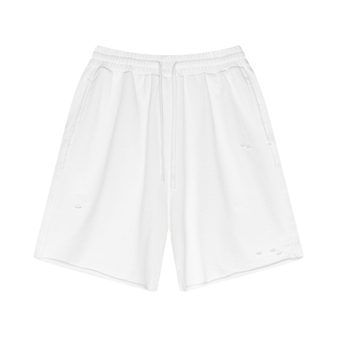 Front view of White 100% cotton shorts with artisan dye-wash and distressed detailing - urban streetwear staple