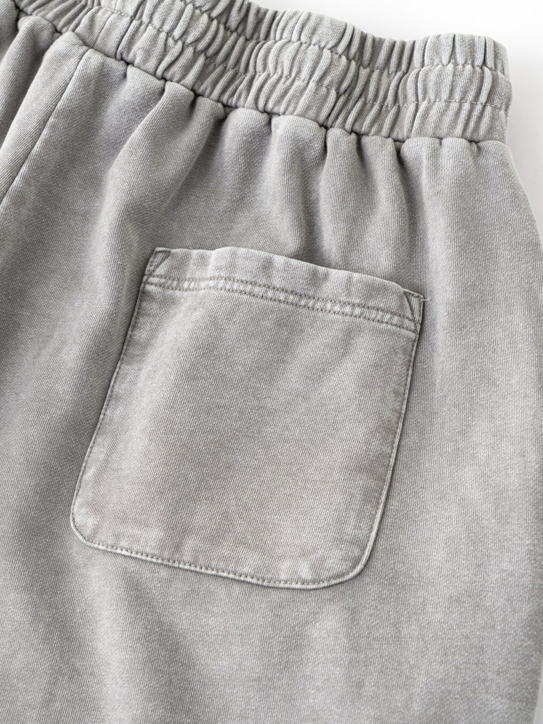 Back pocket reinforcement on Gray cotton shorts - artisan wash and distressed urban style