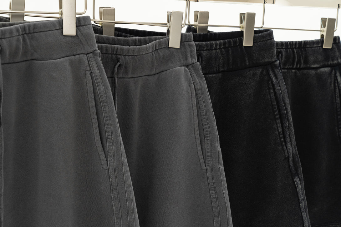 Hanging display of Gray and Black skirts - pigment-dye wash athleisure collection for wholesale