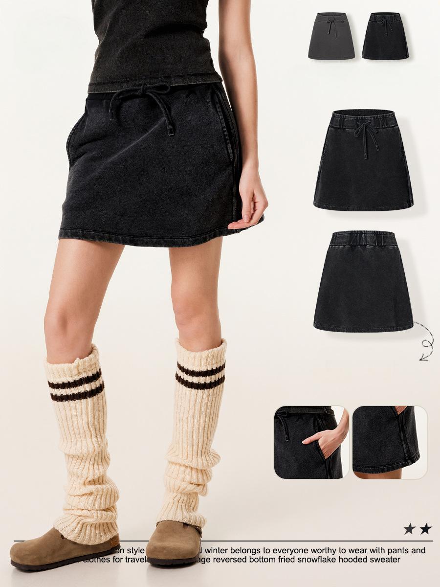 Model demonstrating Gray 100% cotton skirt with pigment-dye wash and built-in shorts transitioning from gym workout to streetwear - wholesale athleisure wear for bulk suppliers