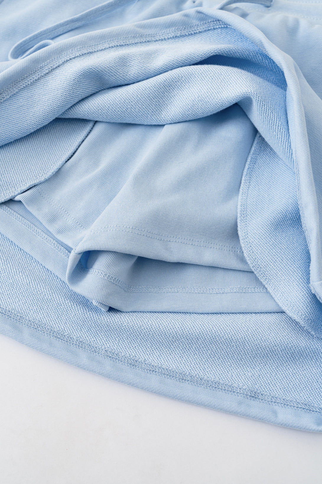 Lining interior of Light Blue athletic skirt - moisture-wicking built-in shorts construction