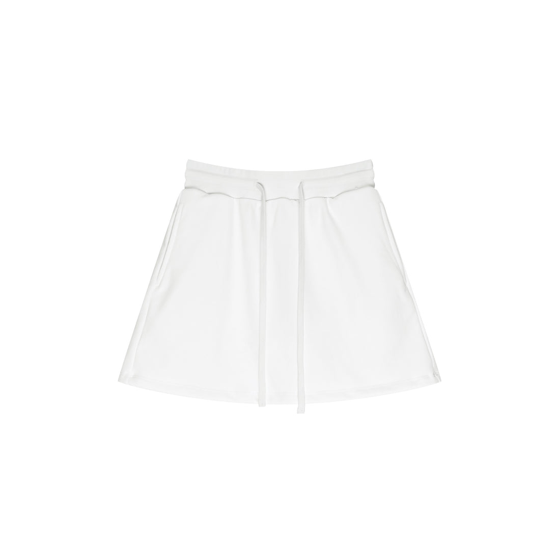 Front view of White 100% cotton skirt with built-in shorts and moisture-wicking technology - gym-to-street athleisure