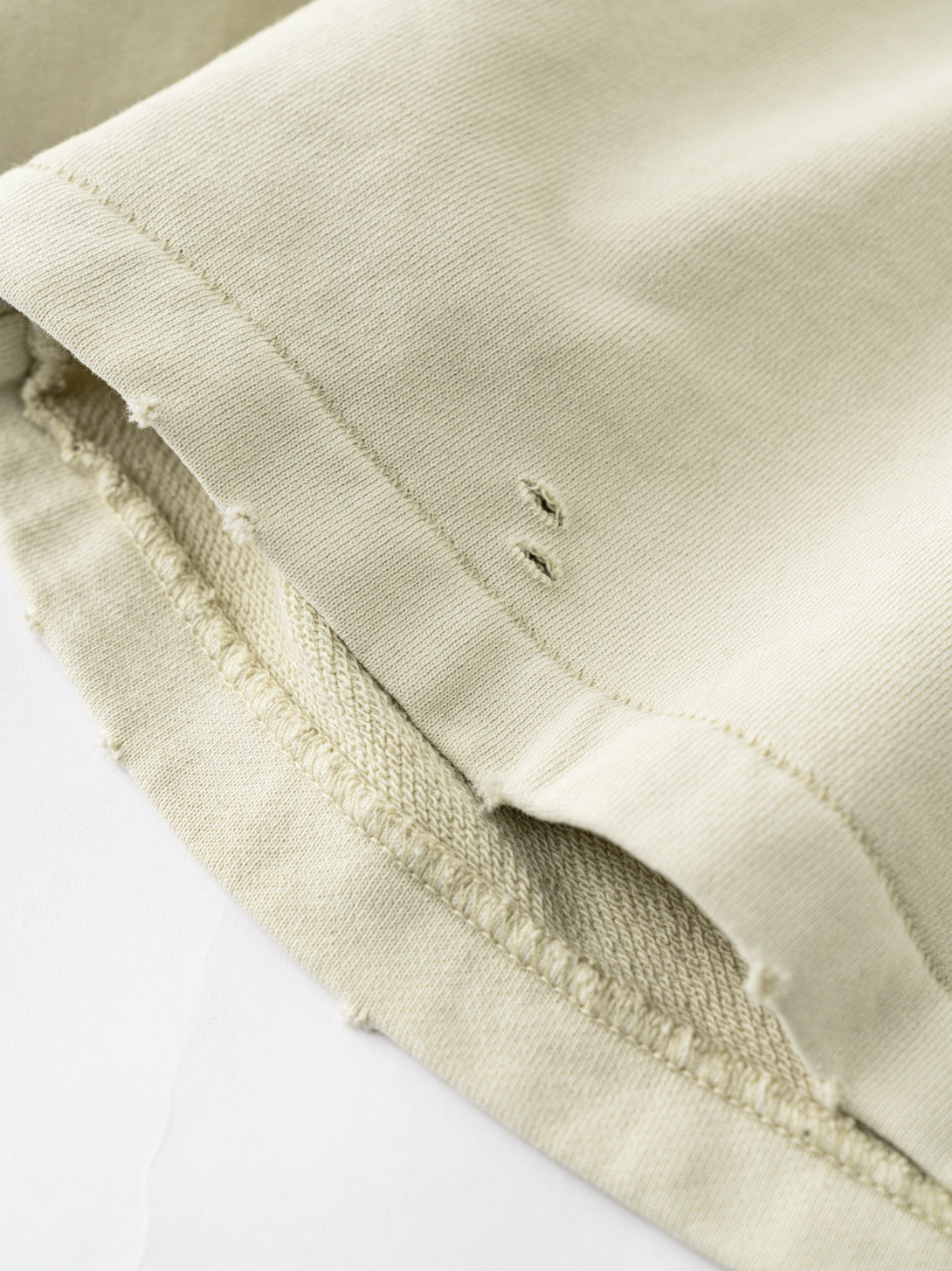 Hem detail of Khaki training shorts - double-stitched reinforcement for durability