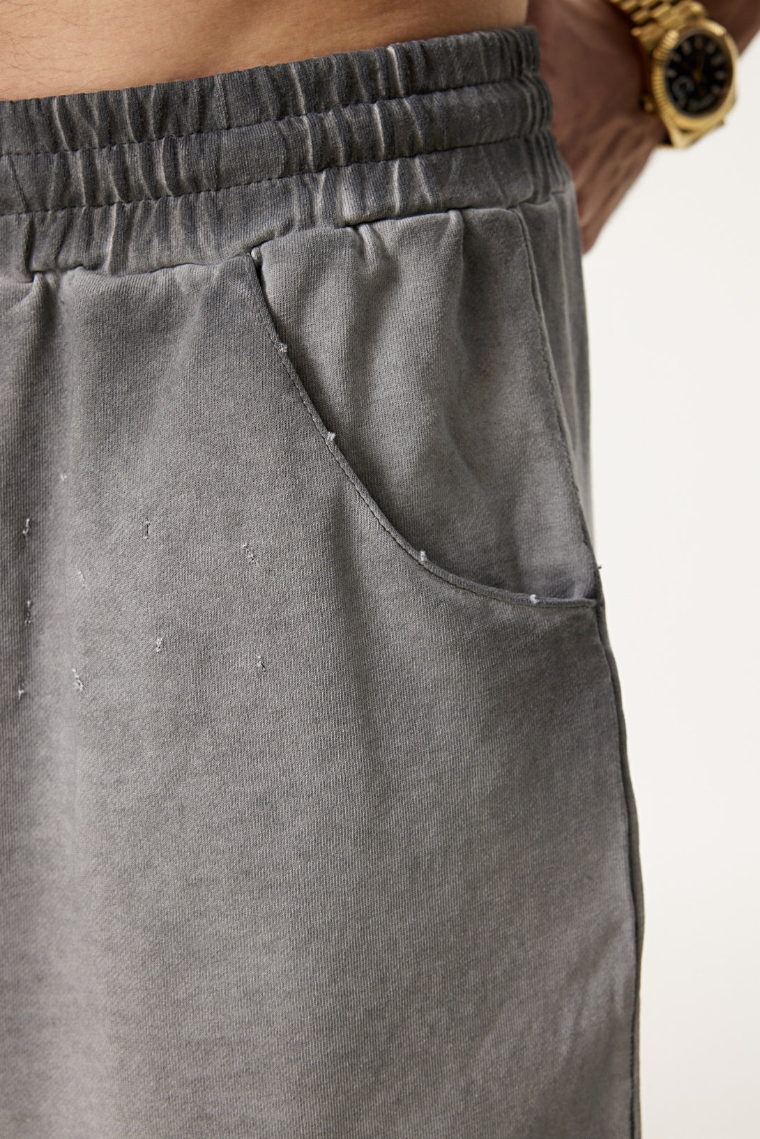 Coffee shorts pocket detail - raw-edge distressing & double stitching