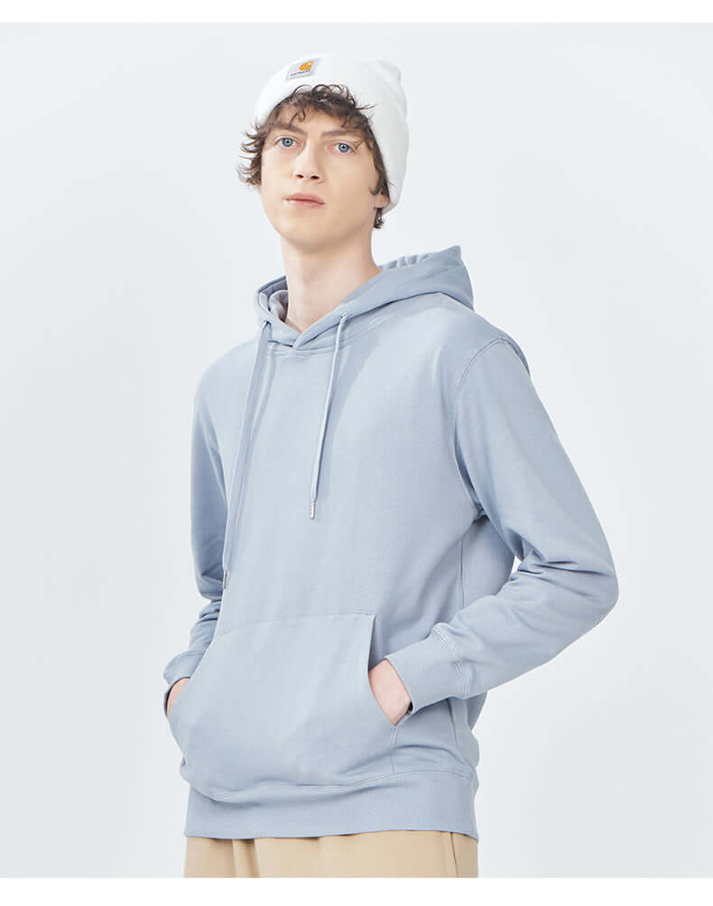 Blank Hoodie Wholesale in light blue color, featuring a hoodie with pockets and a casual style.