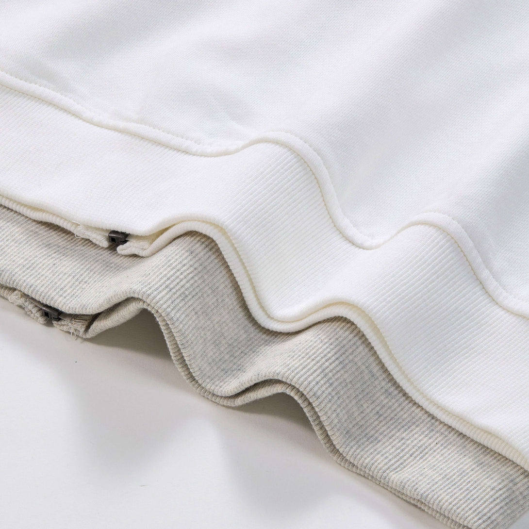 Close-up of the fabric layers of a Blank Zip Hoodie, showcasing soft cotton material and stitching details.