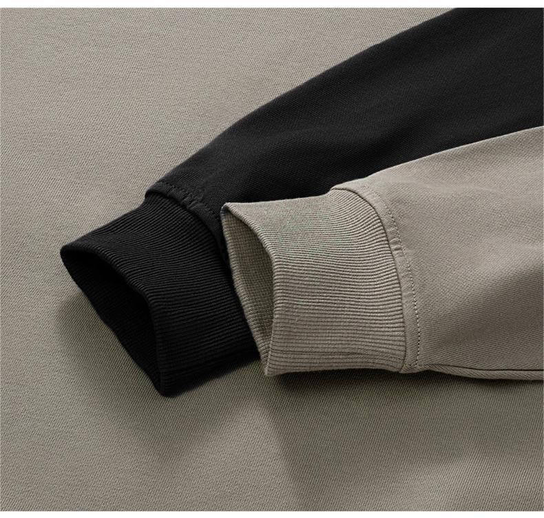 Detail of the cuffs on a Blank Oversized Hoodie in contrasting black and beige colors.
