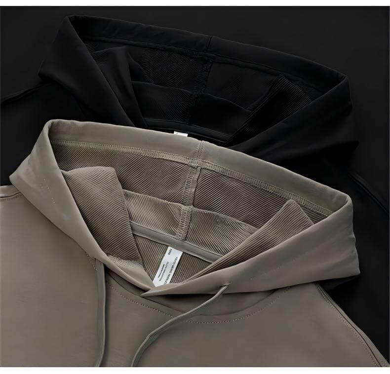 Blank Oversized Hoodie in black and beige showing the inner fabric and drawstring details.