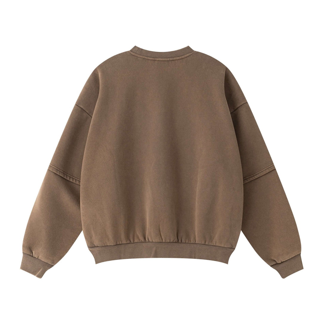 Back view of Distressed Panel Crewneck, a men's fleece lined sweatshirt in brown with unique sleeve panel design.