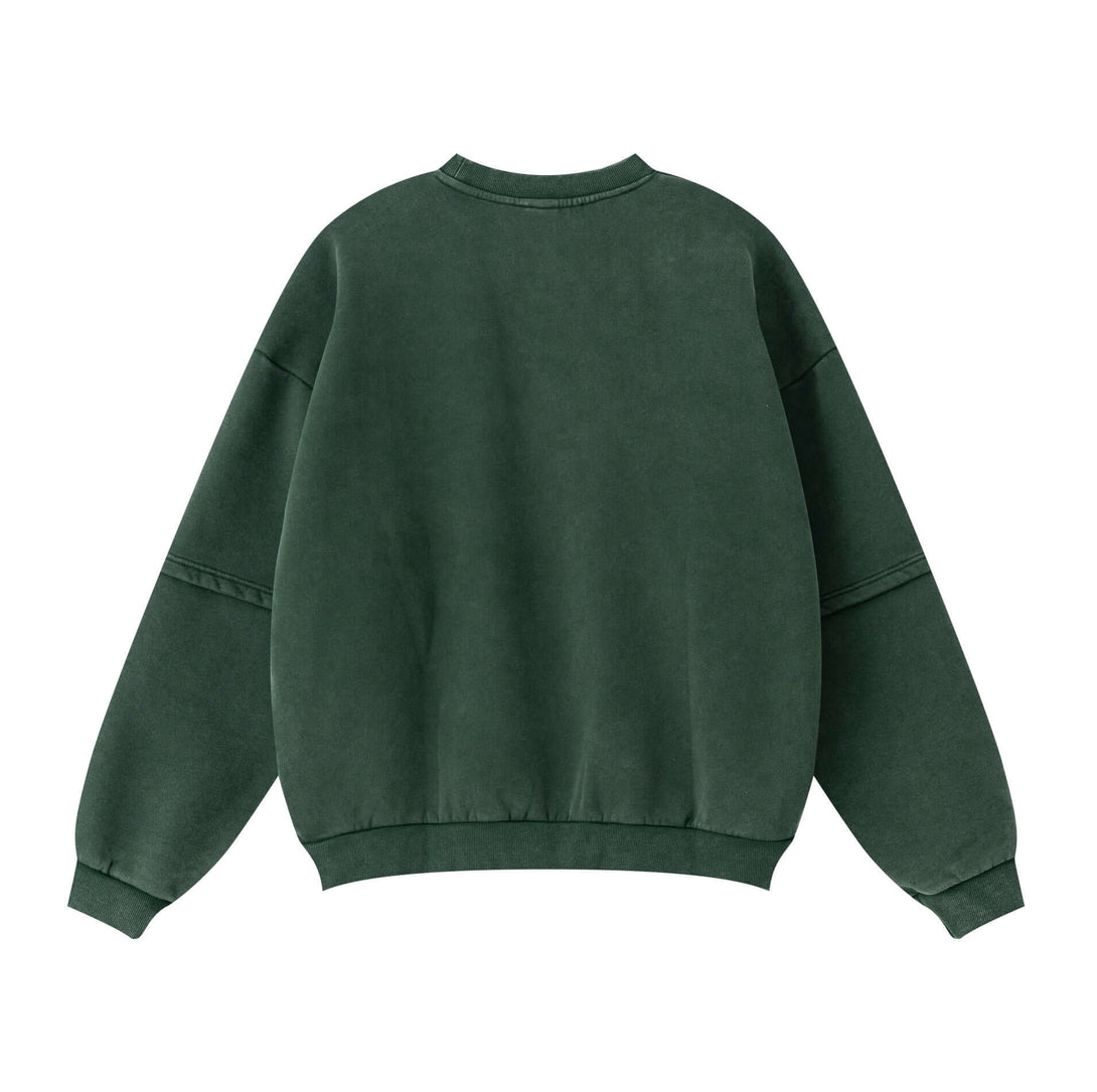 Back view of the Distressed Panel Crewneck in green, showcasing the relaxed fit and unique sleeve panel design.
