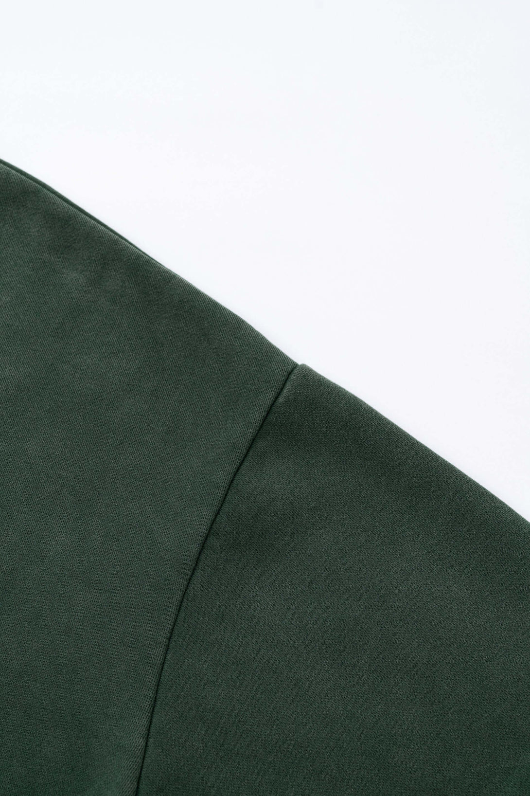 Detail of the sleeve panel on the Distressed Panel Crewneck, showcasing vintage style and texture.