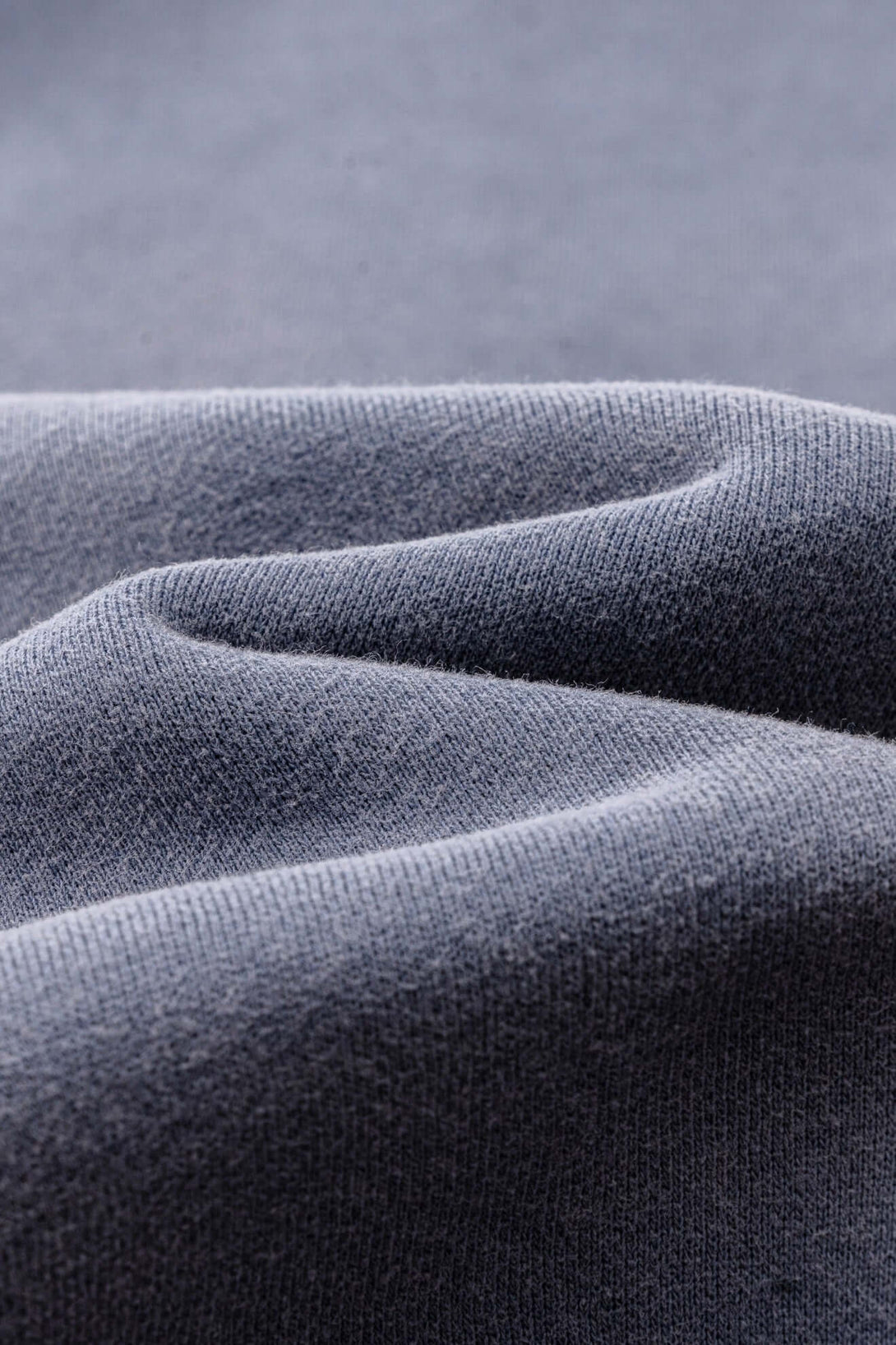 Close-up of premium fabric showcasing the texture of the Spray Effect Quarter Zip fleece pullover.