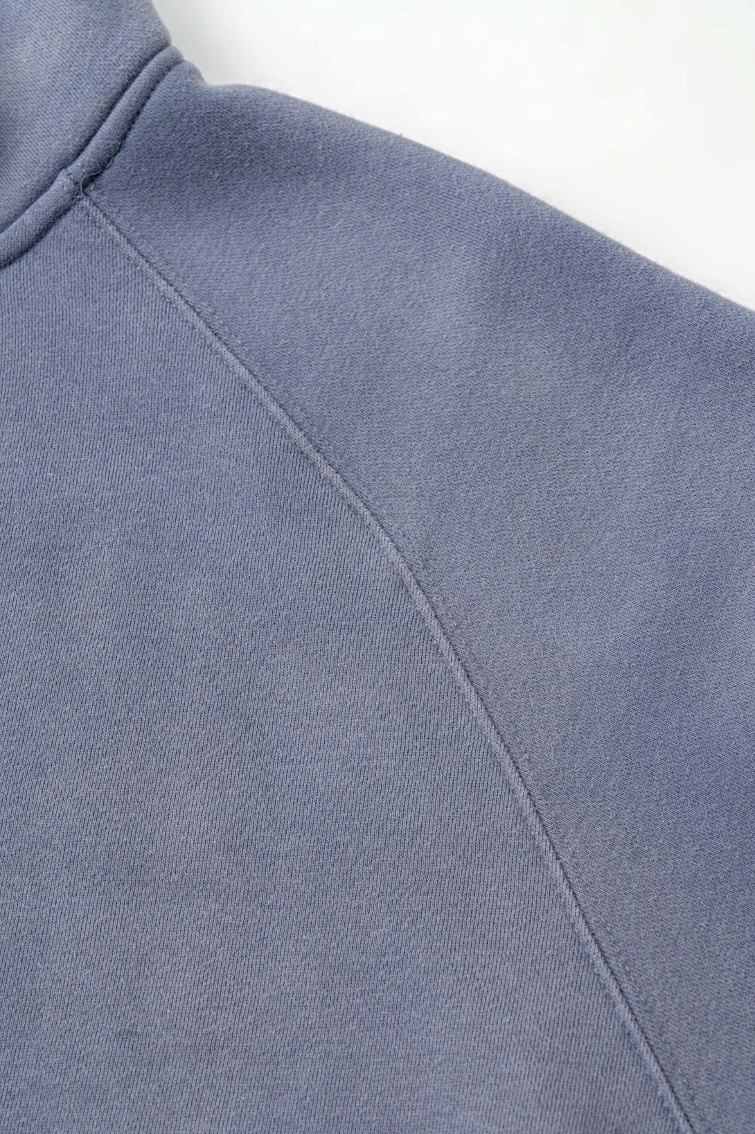 Detail of the Spray Effect Quarter Zip with stand-up collar in soft blue fleece.