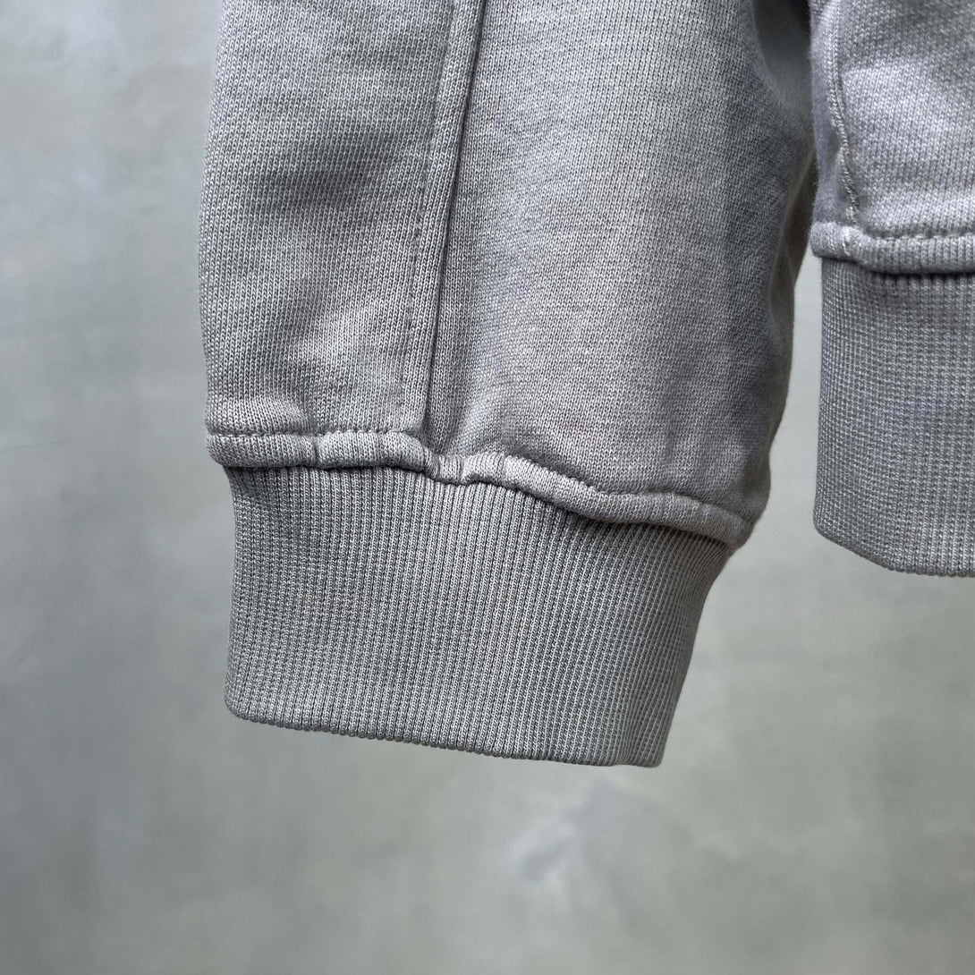 Vintage Spray Paint Hoodie cuff detail with ribbed hem showing quality craftsmanship.
