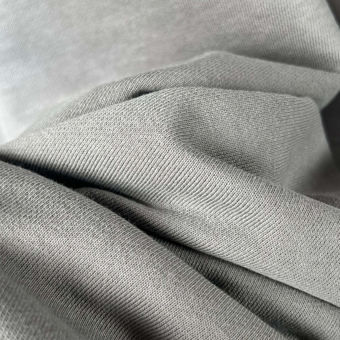 Close-up view of the fabric texture used in the Vintage Spray Paint Hoodie, showcasing the soft and breathable material.