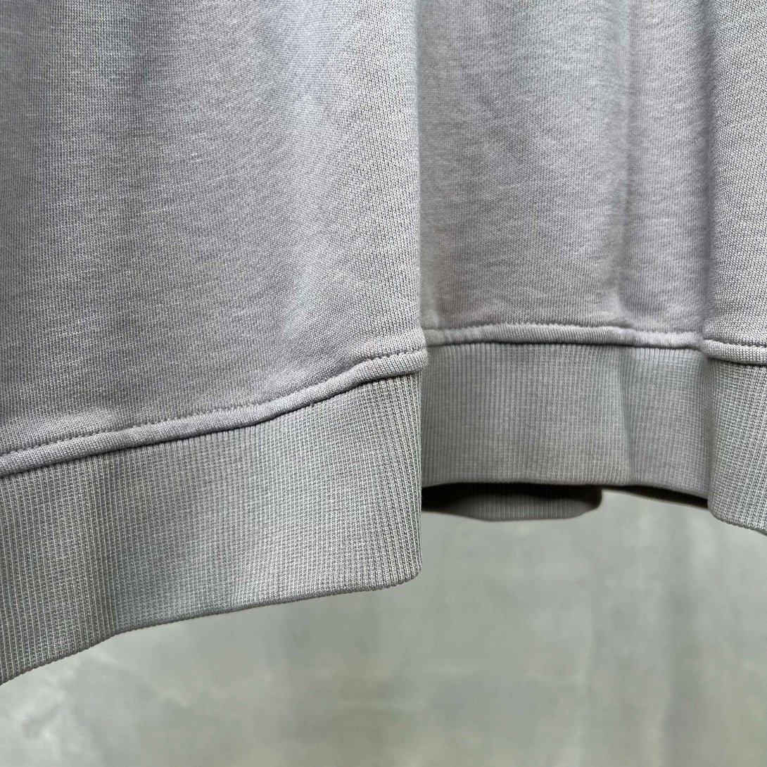 Vintage Spray Paint Hoodie oversized drop shoulder pullover close-up of the hem and cuff details