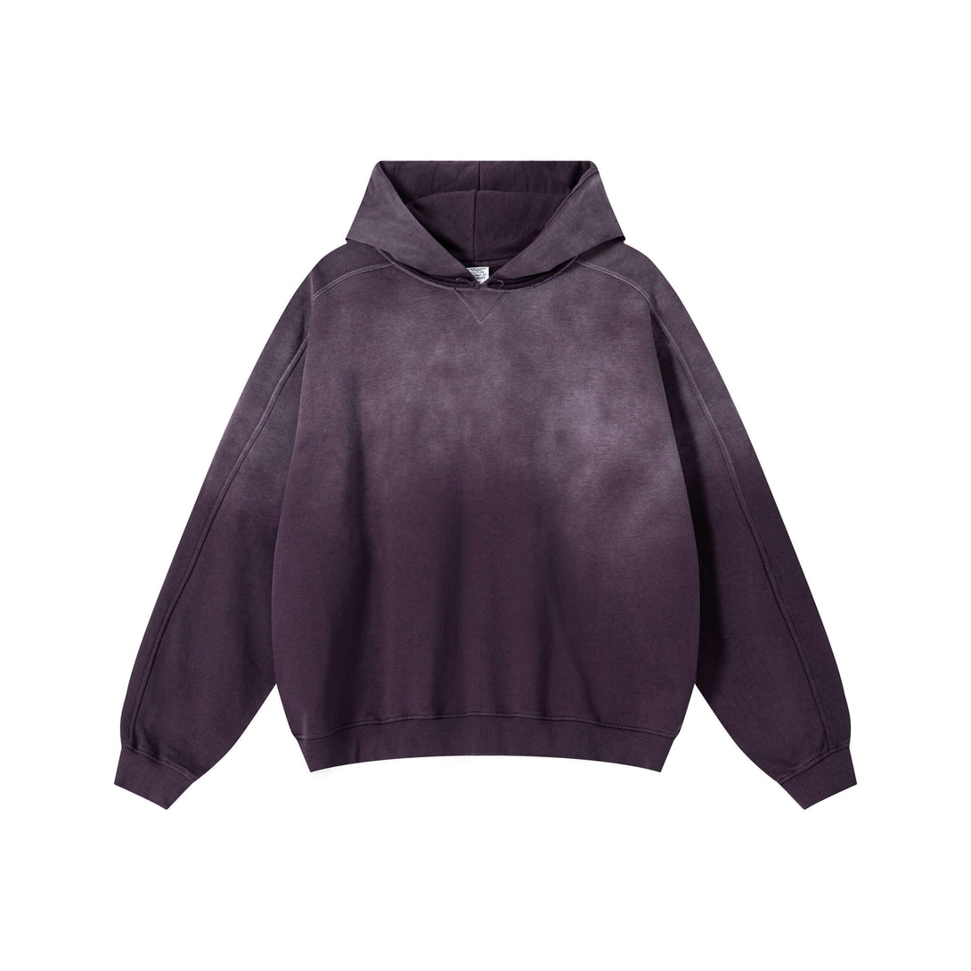 Vintage Spray Paint Hoodie showcasing a unique distressed design and oversized drop shoulder in a dark gradient style.