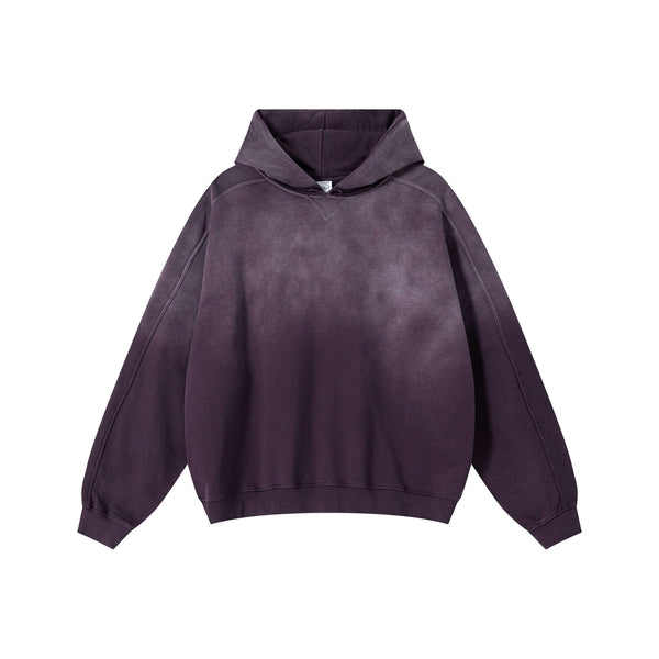 Vintage Spray Paint Hoodie showcasing a unique distressed design and oversized drop shoulder in a dark gradient style.