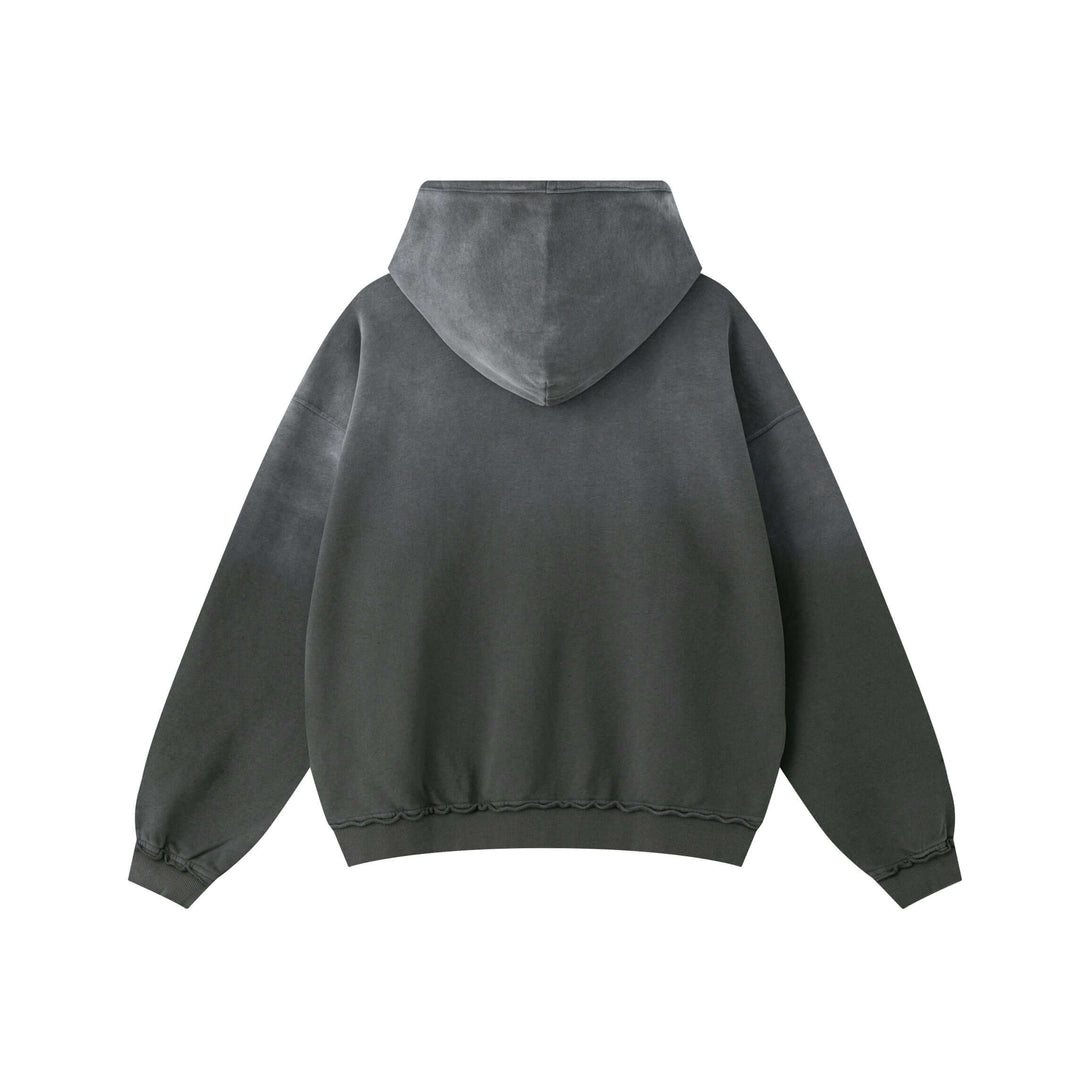 Back view of a Vintage Batik Hoodie showcasing its distressed washed look and oversized fit.