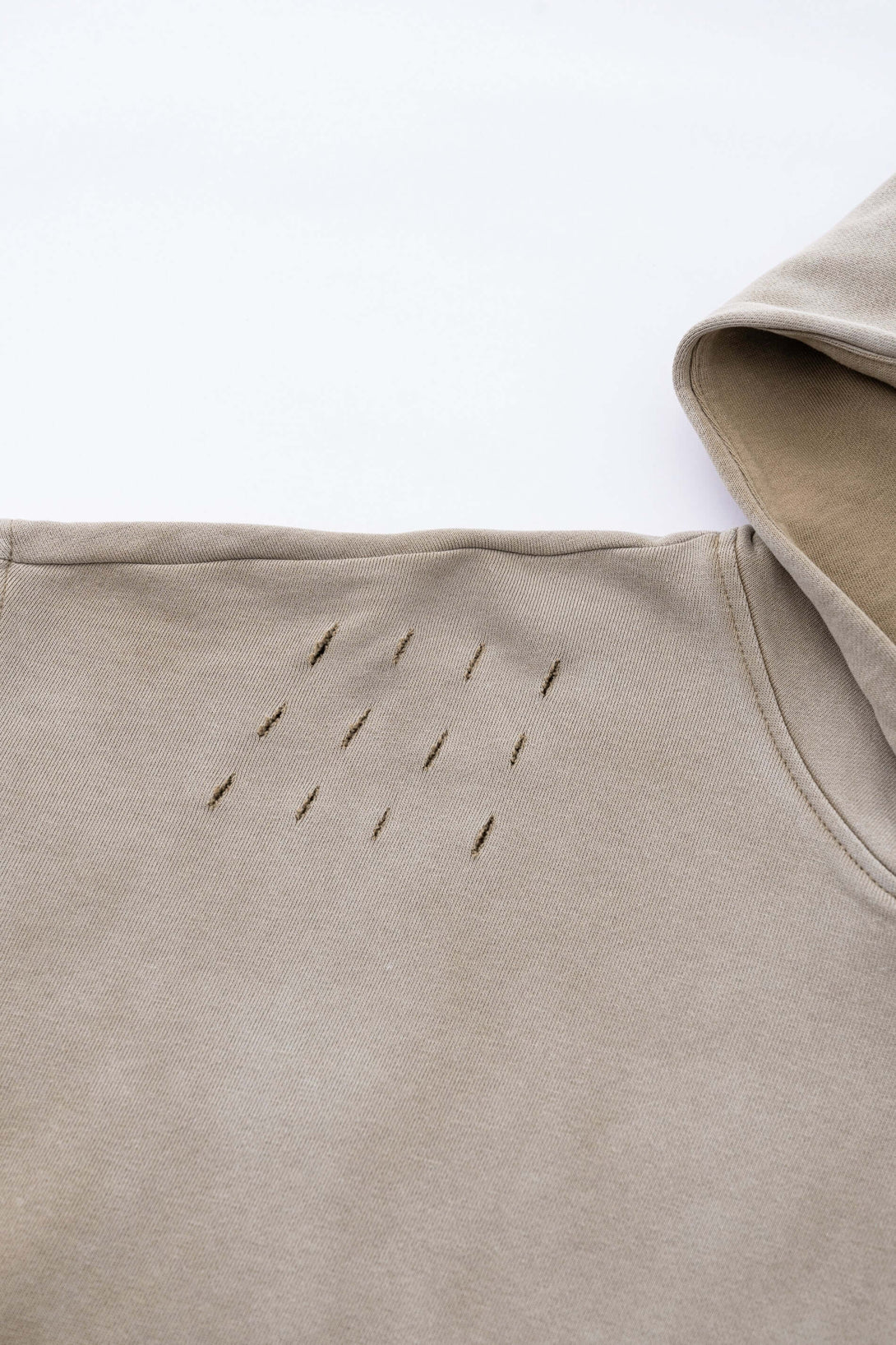 Vintage Batik Hoodie showing distressed shoulder rips and unique artisan detailing.