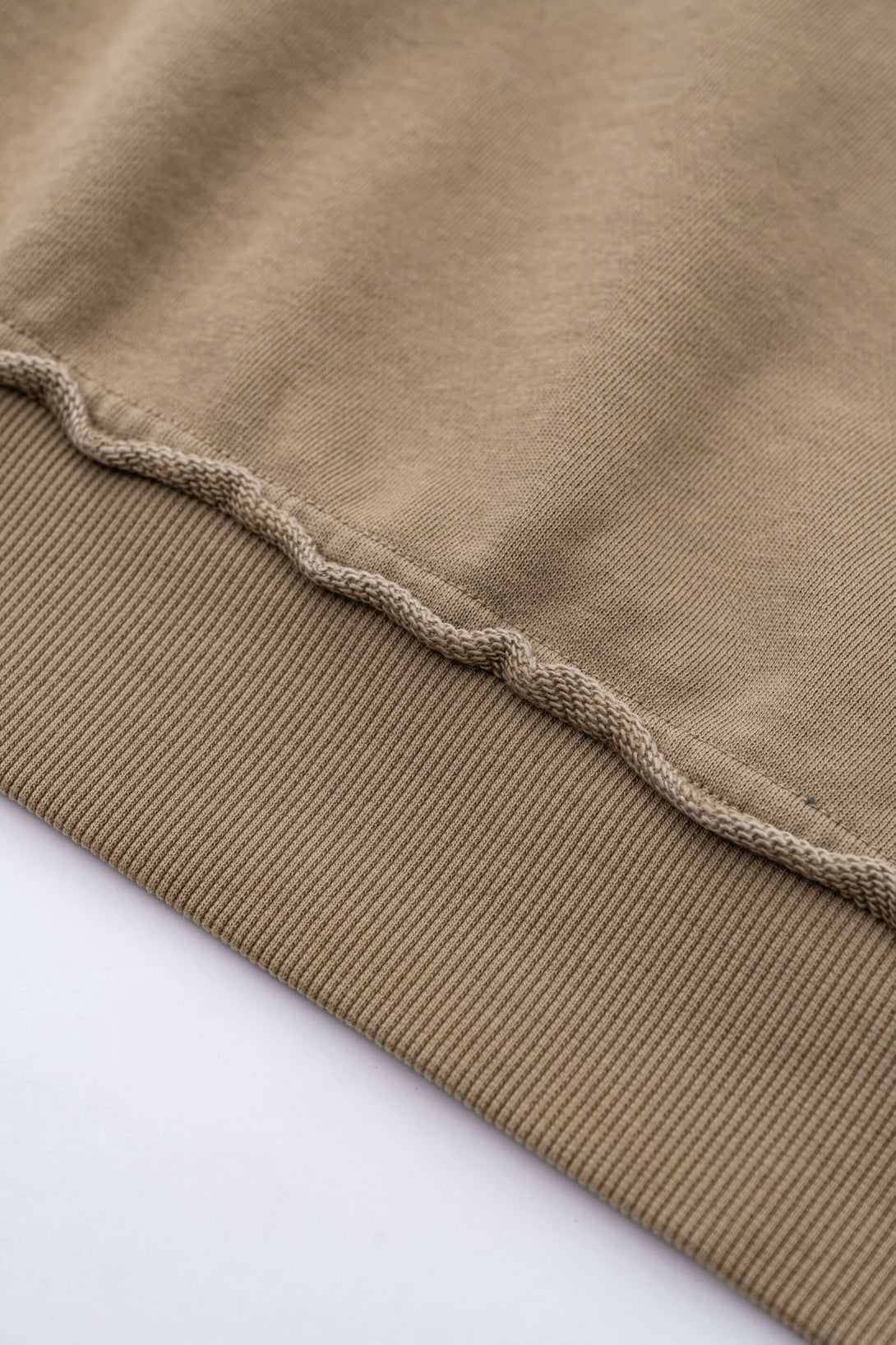 Close-up of the raw edge detailing on the Vintage Batik Hoodie, showcasing its unique texture and artisan craftsmanship.