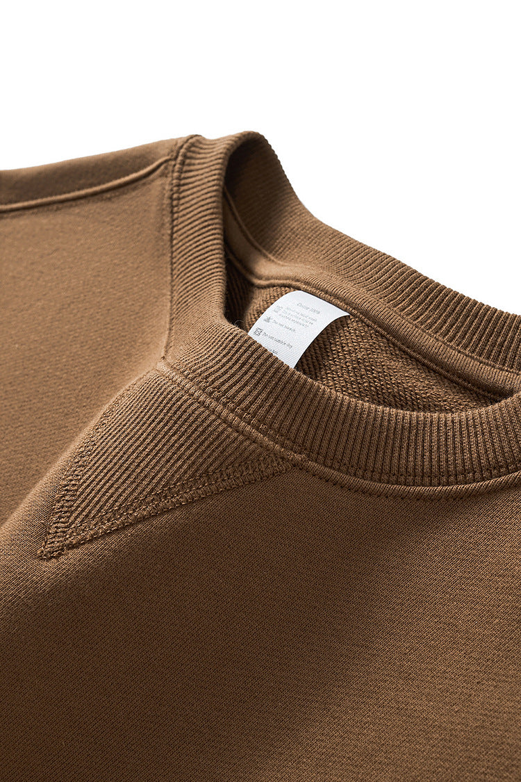 Close-up of front collar on 380g round-neck pullover sweatshirt.