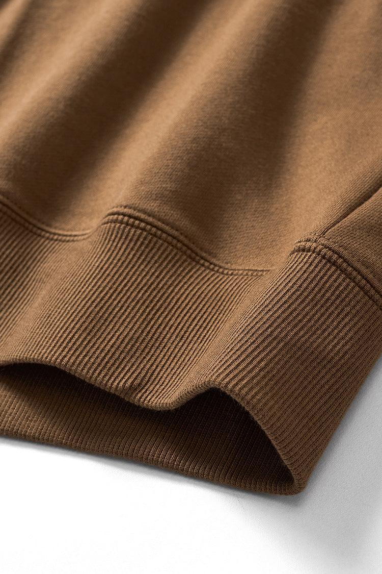 Hem ribbing and precision stitching on round-neck pullover sweatshirt.