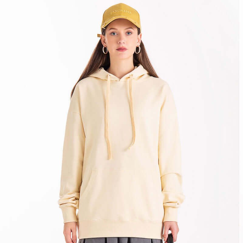Woman wearing apricot hoodie outfit