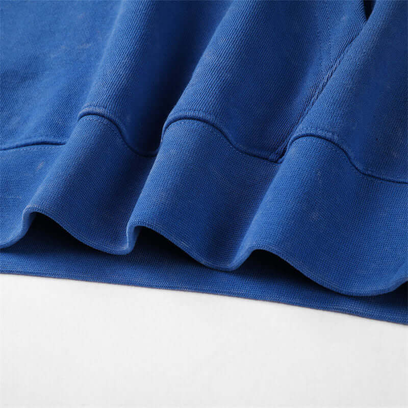 Hem reinforcement on drop-shoulder cotton hoodie