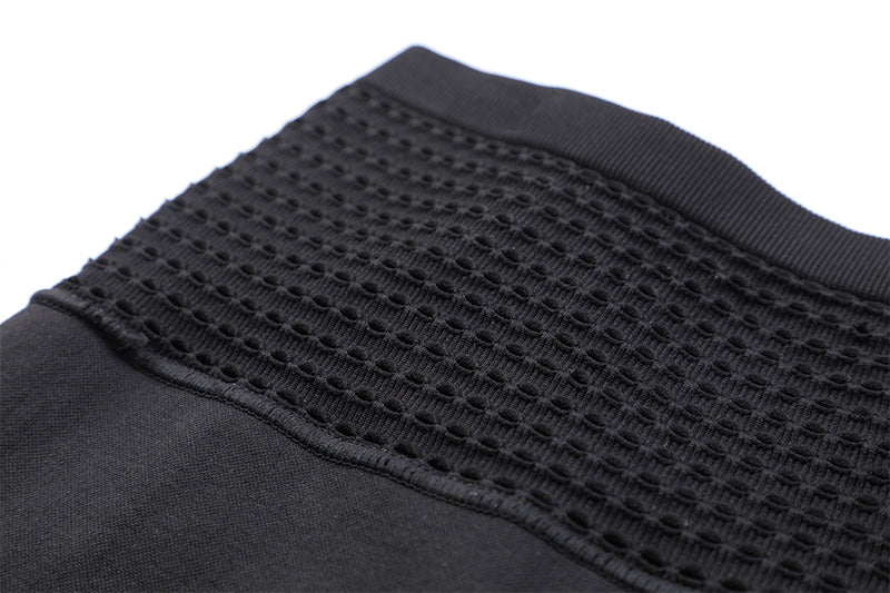 Close-up of front waistband on black compression shorts