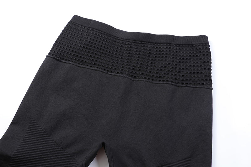 Close-up front waistband detail of men's compression shorts