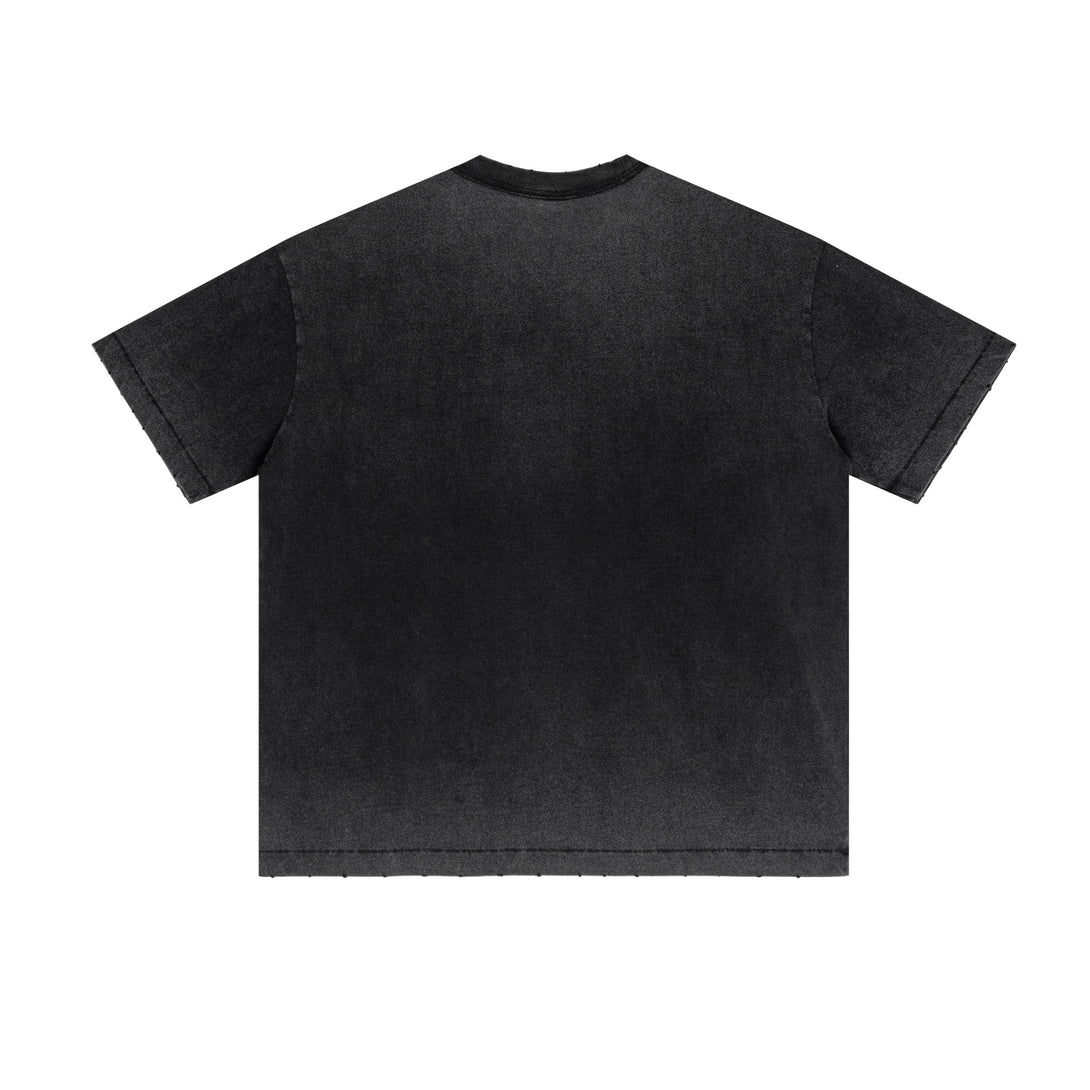 Back view black raw-edge tee | Distressed pigment wash | Bulk apparel production
