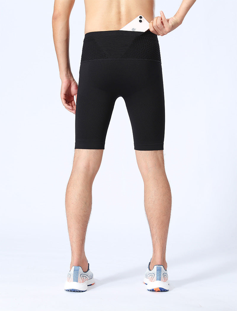 Model back view in black performance compression shorts