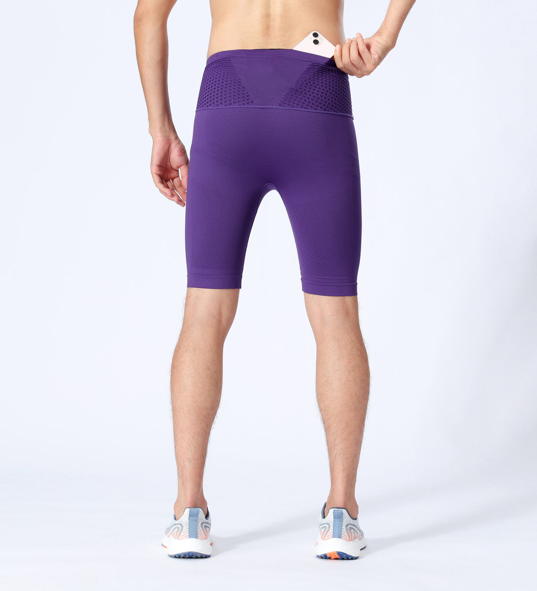 Model showing back design of purple compression shorts