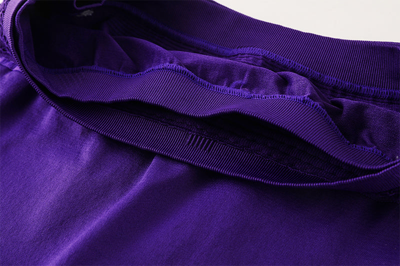 Interior waistband lining of purple training shorts