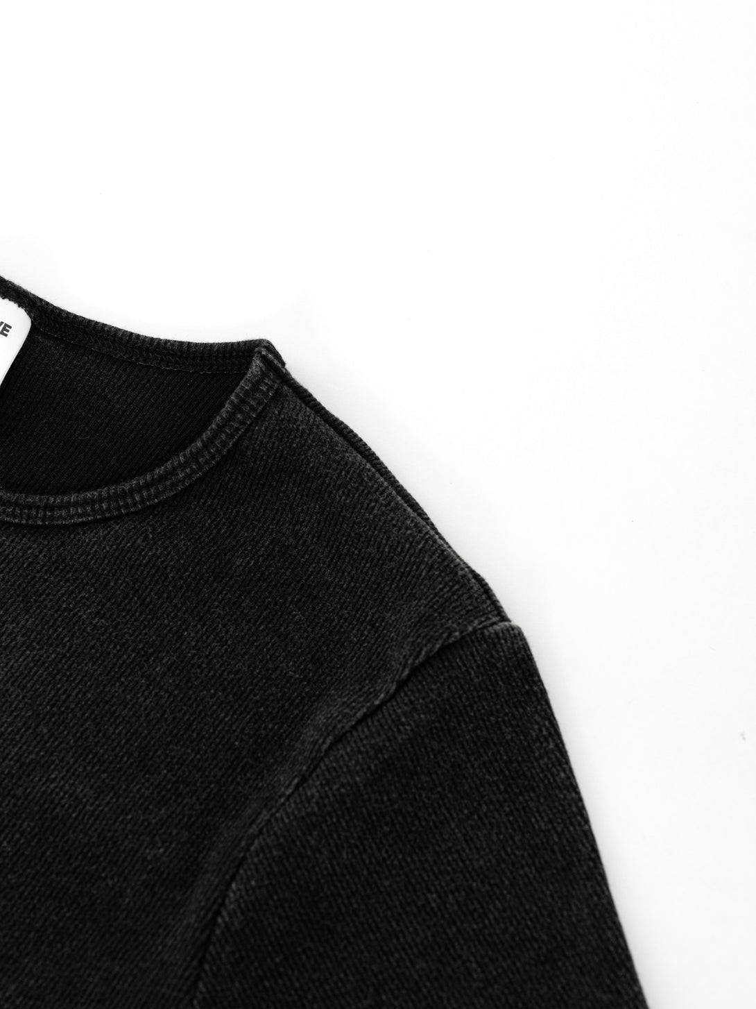 Shoulder seam construction with snow wash effect