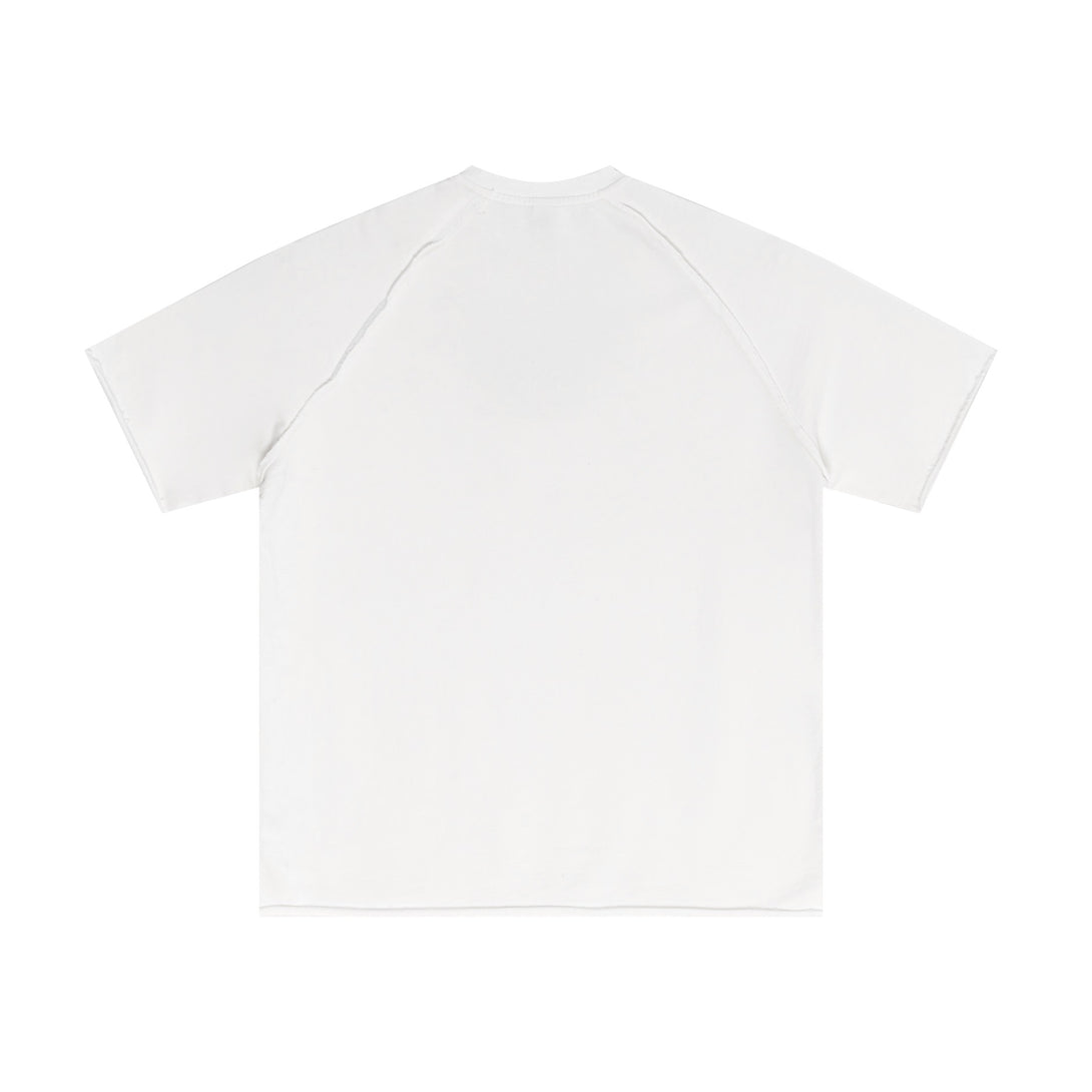 Back view of off-white artisan snow-wash tee with raw-edge detailing. Vintage oversized streetwear for wholesale suppliers.