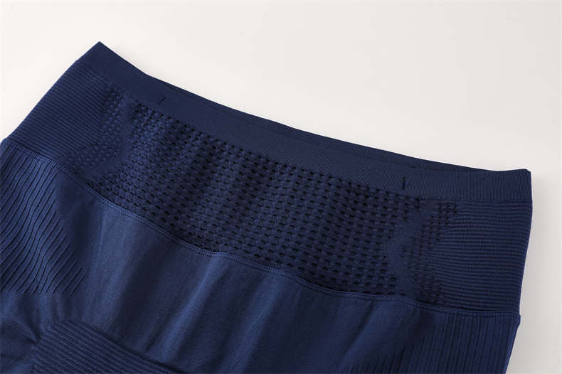 Close-up of front waistband on blue compression pants