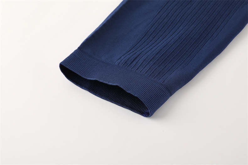 Hem finishing technique on blue athletic pants