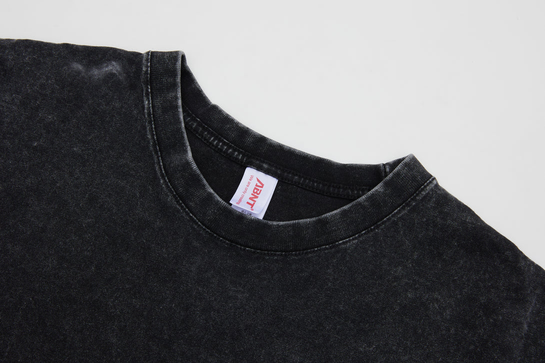 Close-up detail of 1x1 ribbed collar on cotton vintage wash t-shirt