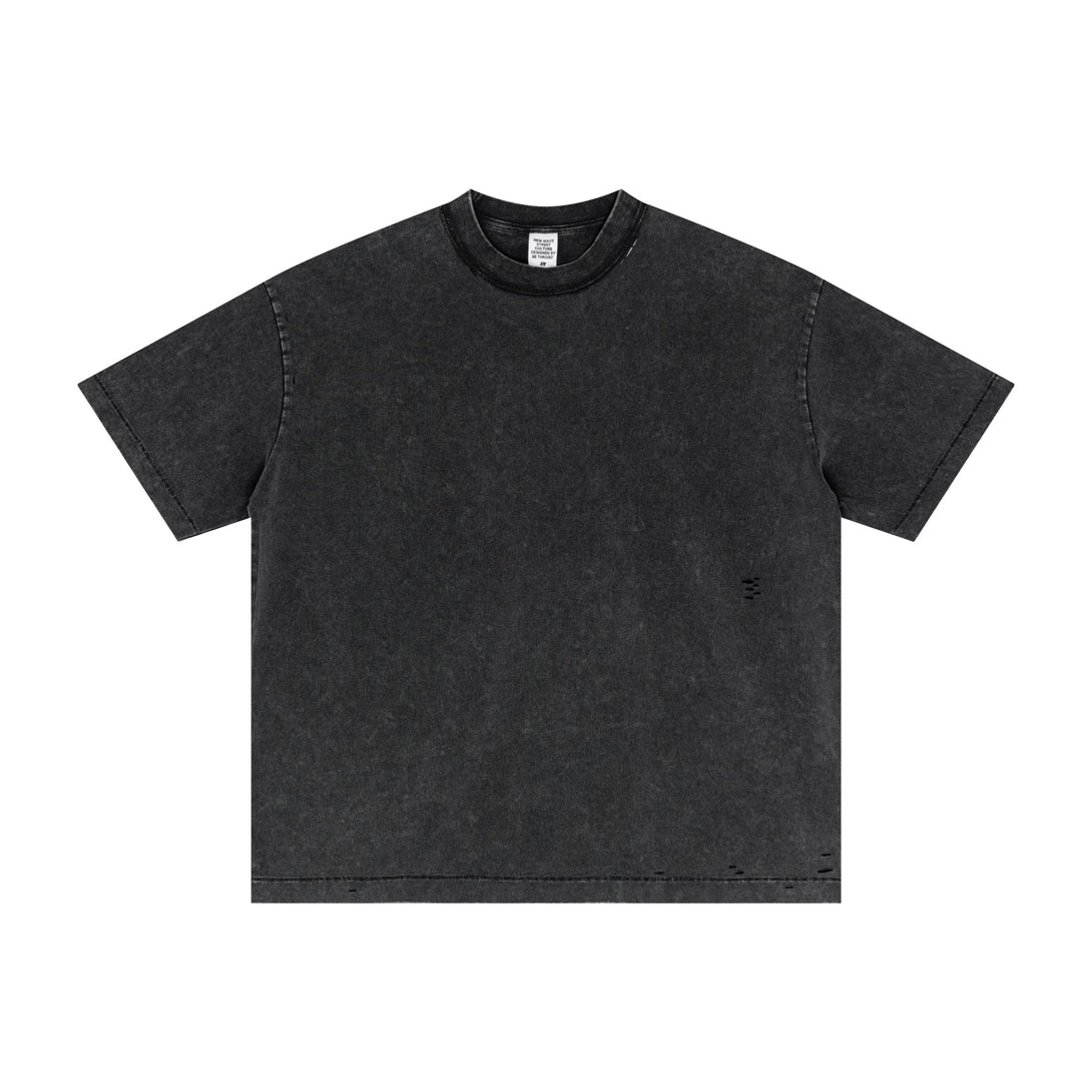 Black oversized cotton tee with SS25 vintage wash and pigment-dyed finish, distressed detail front view. Bulk wholesale streetwear staple for apparel suppliers.