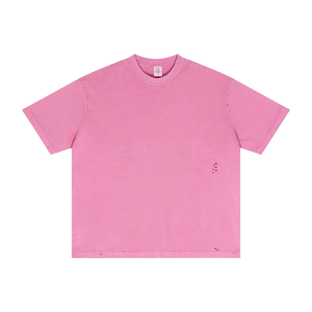Rose red distressed cotton tee showcasing pigment-dyed effect and raw hem, oversized front. Streetwear bulk supplier stock.