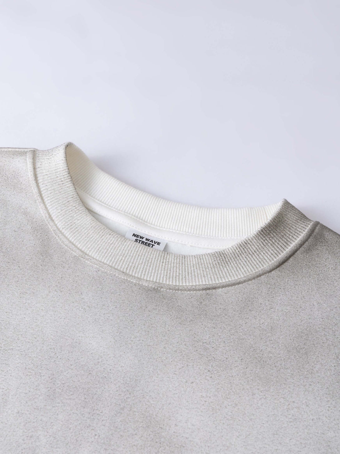 Men's 340g Gray Spray-Dye Camo Crew Neck featuring a classic crew neck design and unique spray-dye fabric.