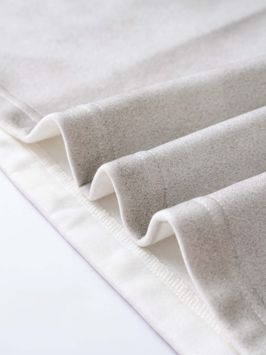 Men's 340g Gray Spray-Dye Camo Crew Neck fabric detail showing the unique spray-dye texture and design.