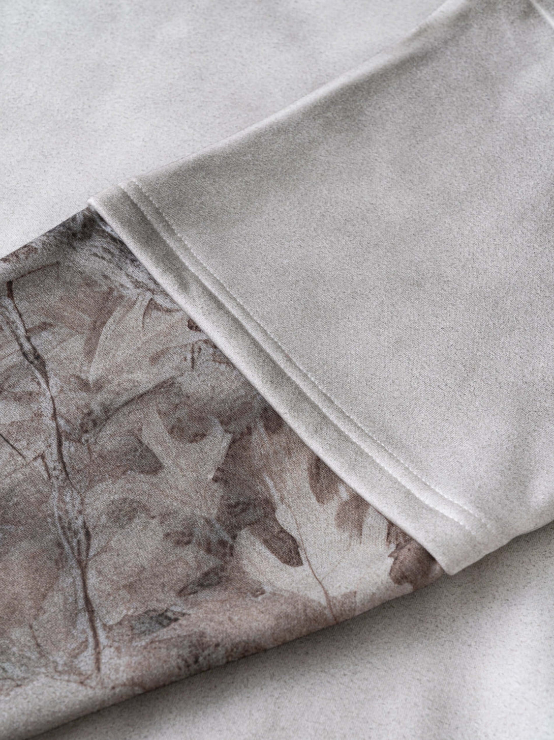 Men's 340g Gray Spray-Dye Camo Crew Neck sleeve showing unique camo print detail and soft fabric texture.