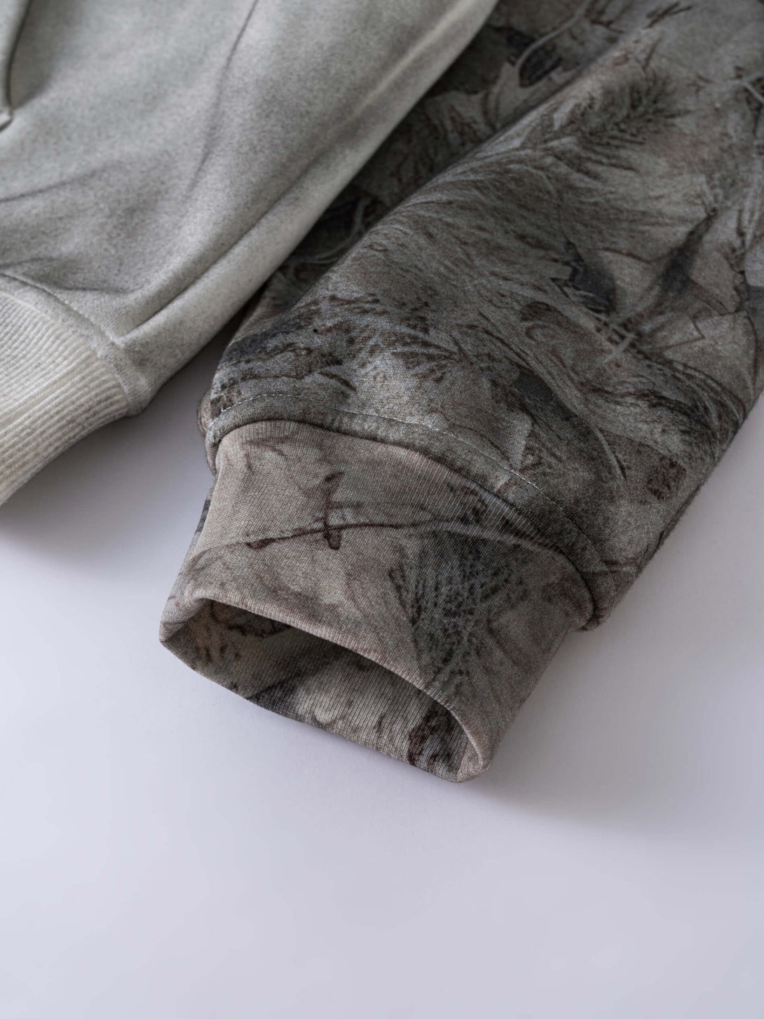 Men's 340g Grey Camo Weighted Hoodie showcasing detailed spray-dye fabric and heat-transfer camouflage sleeves.