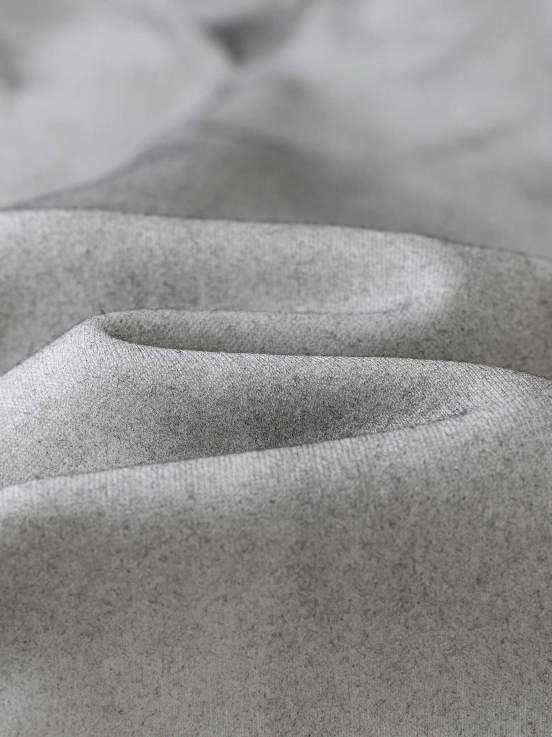 Close-up of soft grey fabric used in Men's 340g Grey Camo Weighted Hoodie, showcasing texture detail.