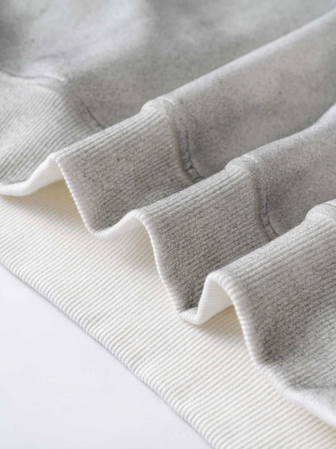 Men's 340g Grey Camo Weighted Hoodie close-up of grey camo fabric and ribbed cuffs for comfort and style.