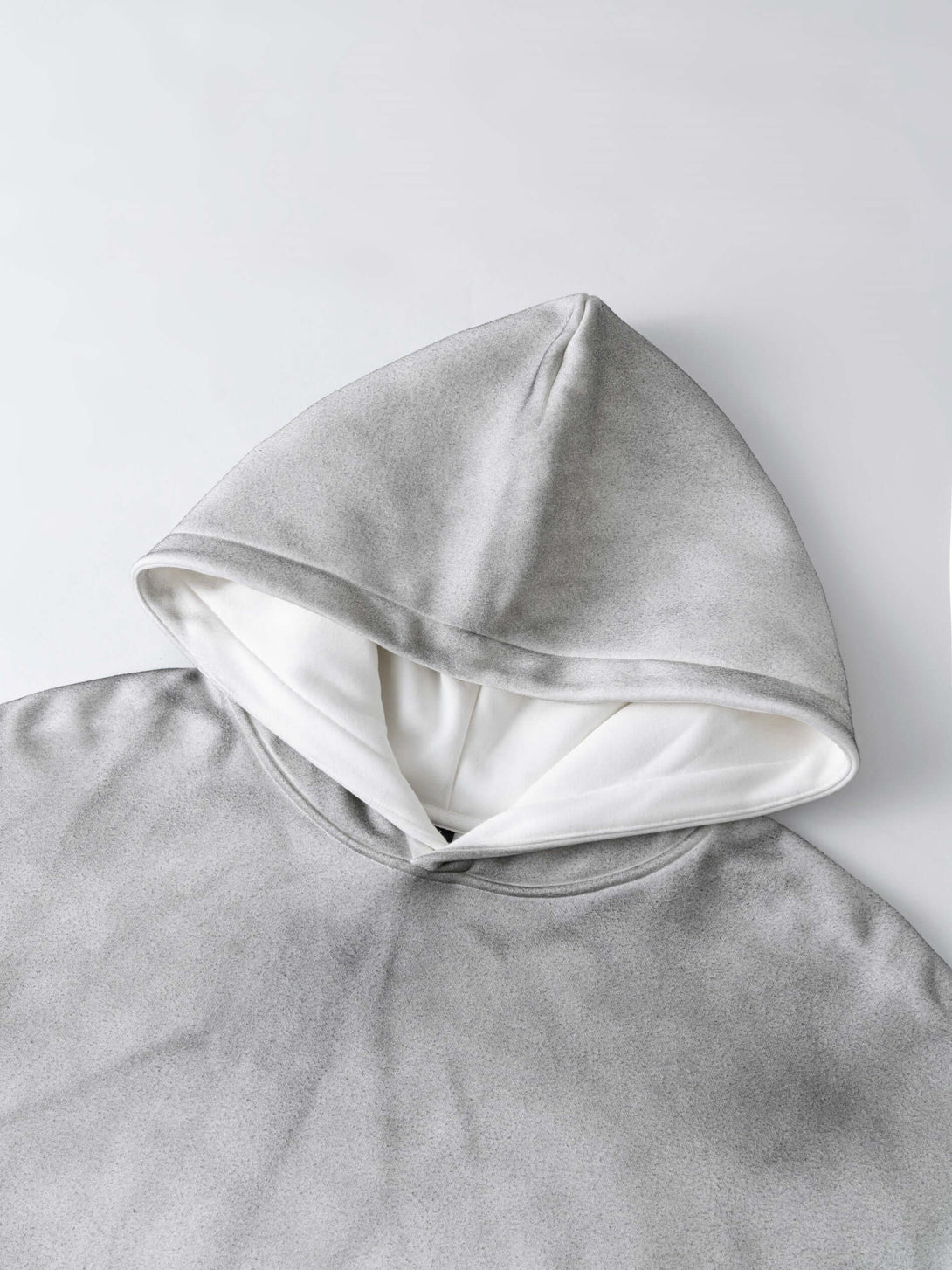 Men's 340g Grey Camo Weighted Hoodie featuring a stylish gray spray-dye design and comfortable hood.