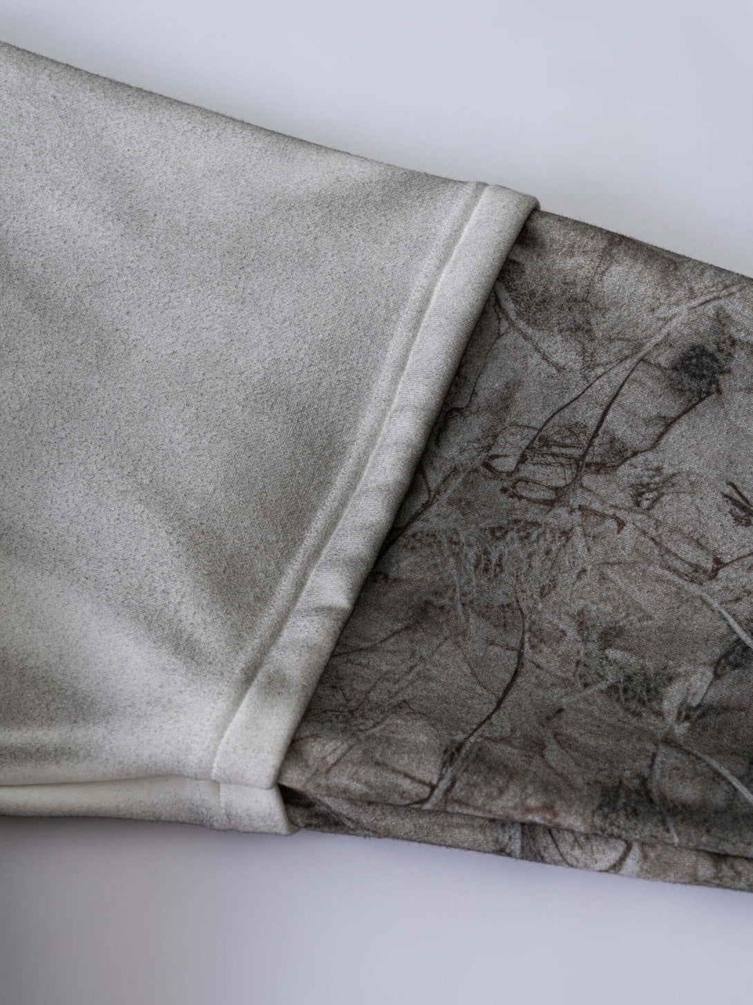 Men's 340g Grey Camo Weighted Hoodie showcasing the unique spray-dye fabric and camouflage pattern on layered sleeves.